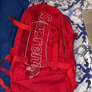 Supreme red bookbag with key chain